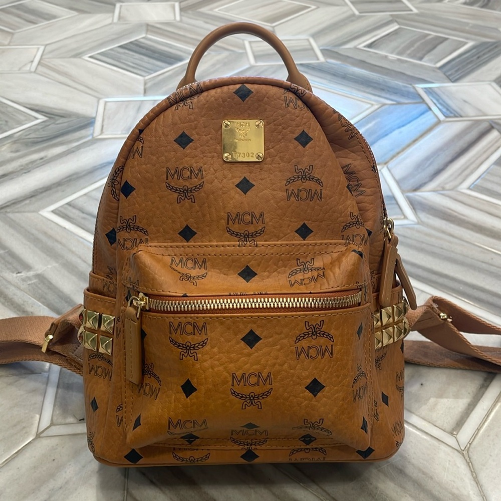 MCM Stark small backpack. Cognac with gold studs on side.